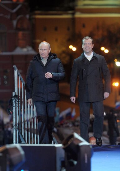 D. Medvedev and V. Putin appear at a rally in Manege Square