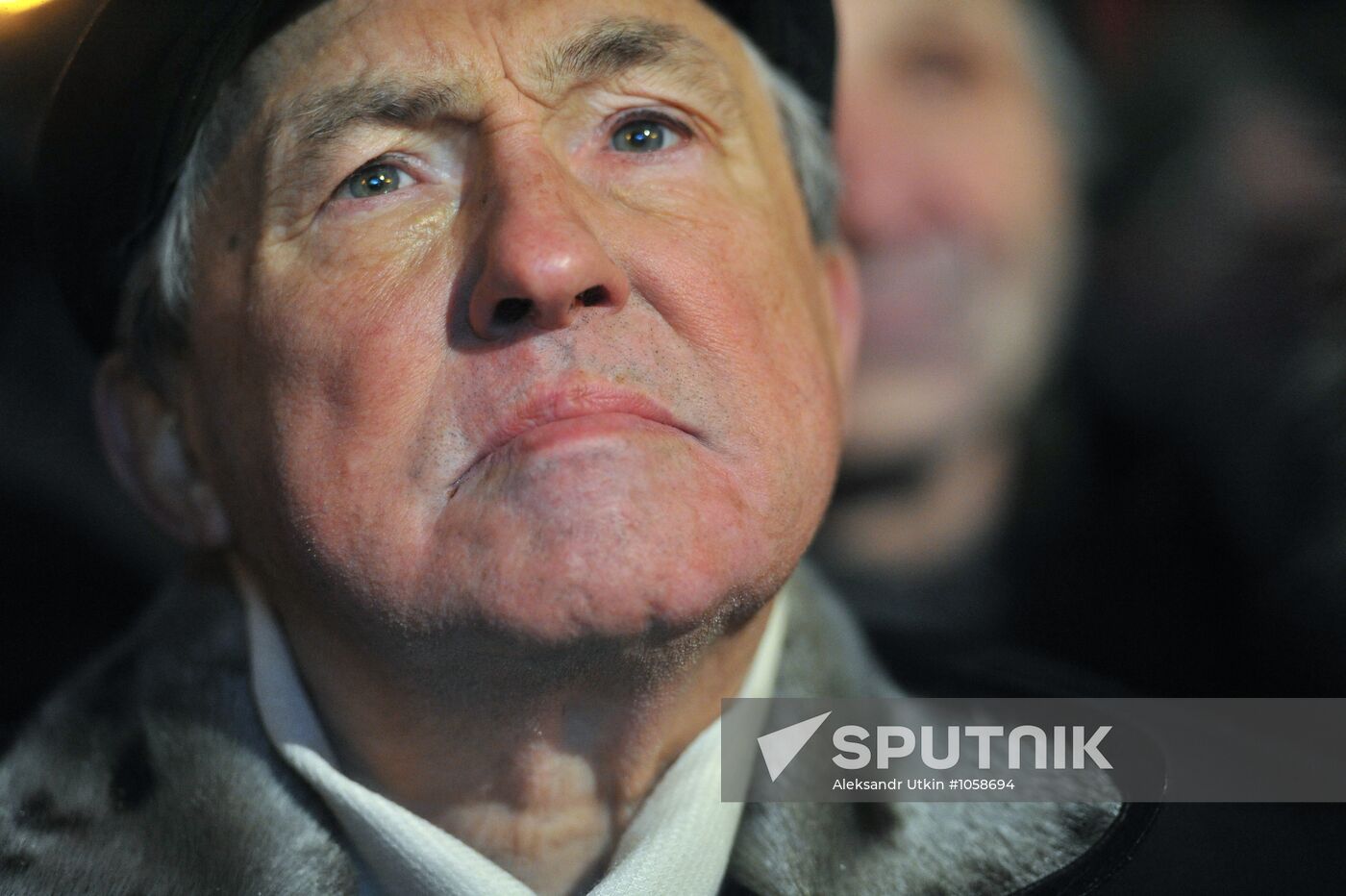 Faces of people rallying on Pushkin Square in Moscow