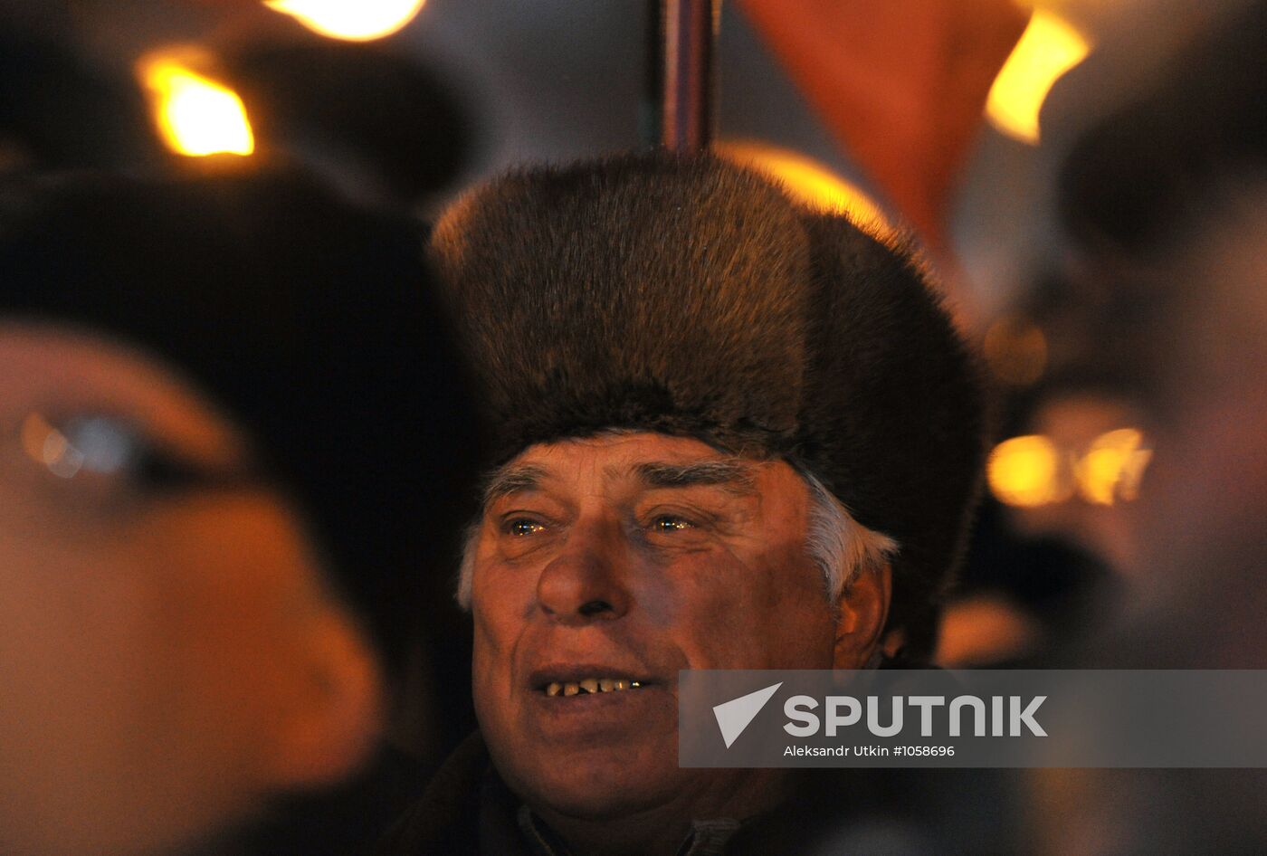Faces of people rallying on Pushkin Square in Moscow