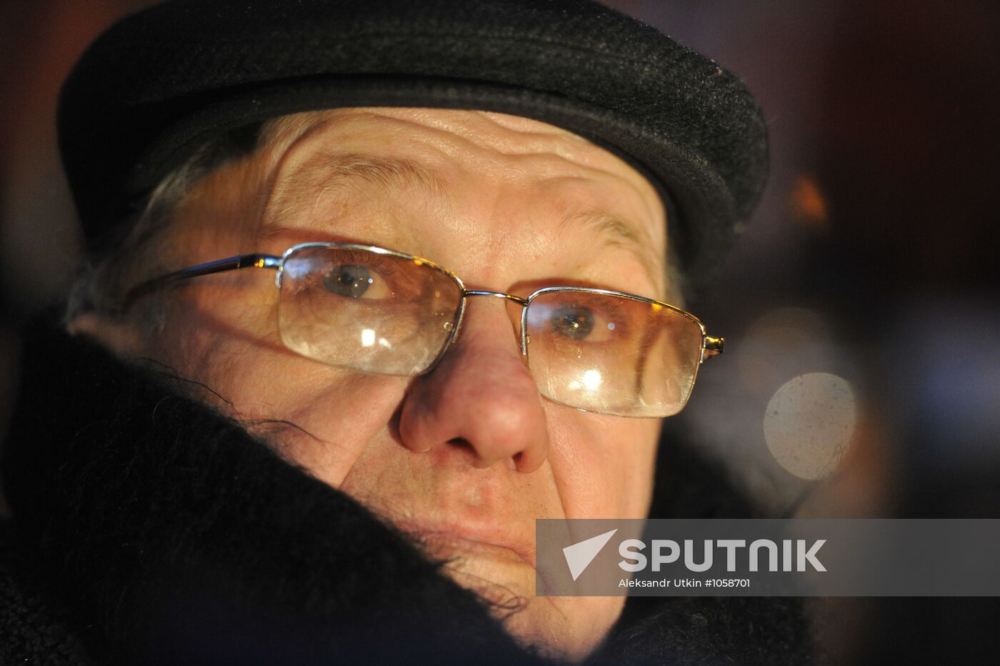Faces of people rallying on Pushkin Square in Moscow