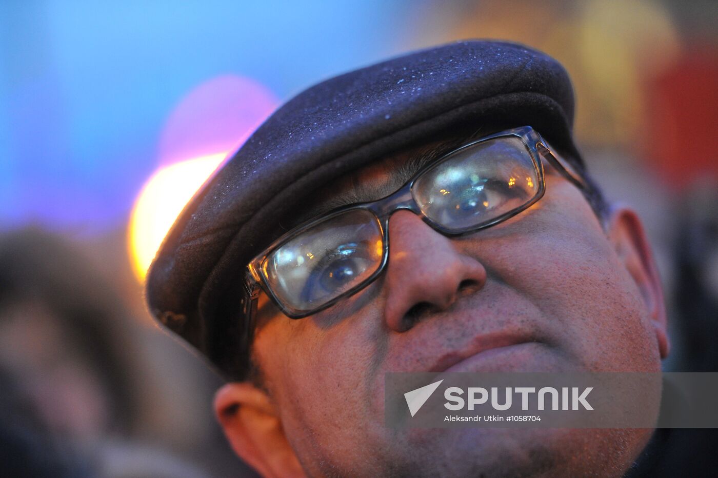 Faces of people rallying on Pushkin Square in Moscow