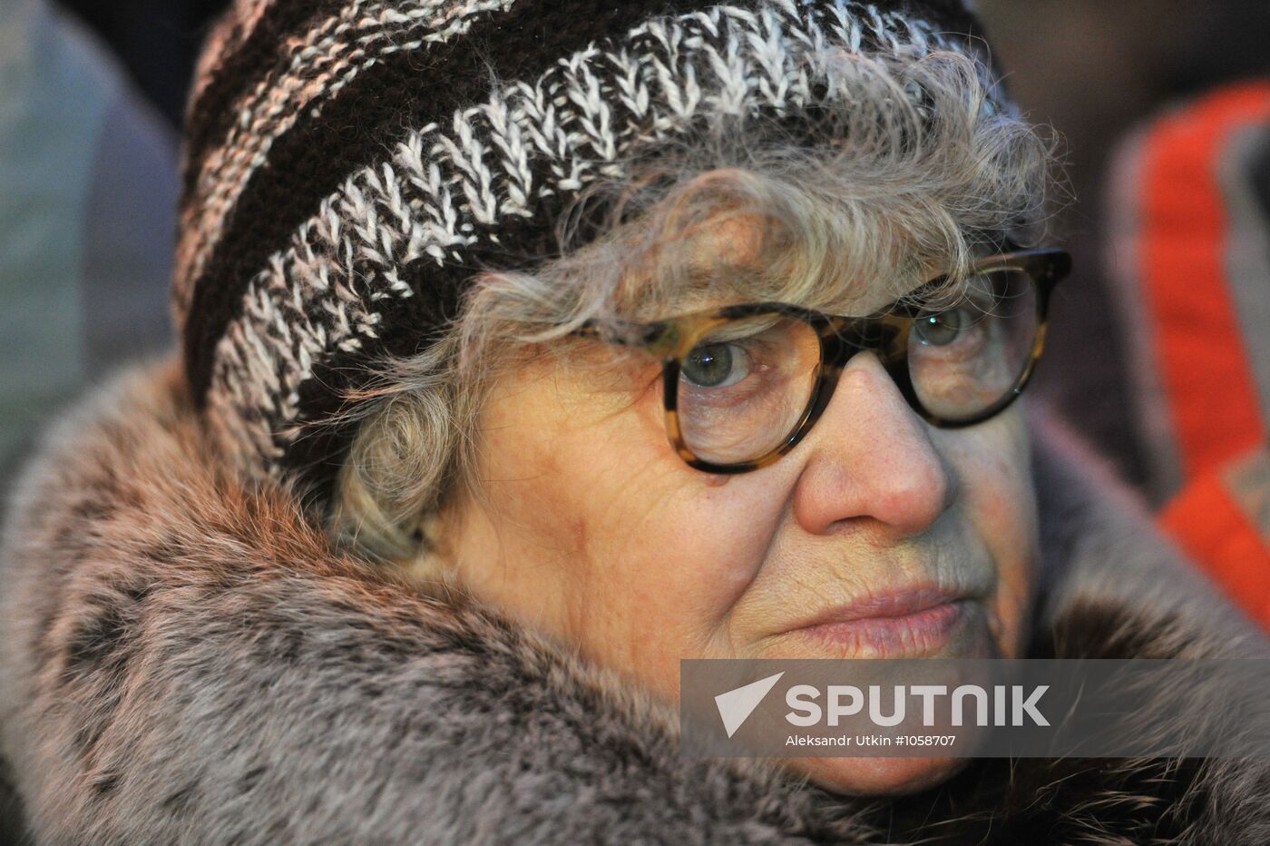 Faces of people rallying on Pushkin Square in Moscow