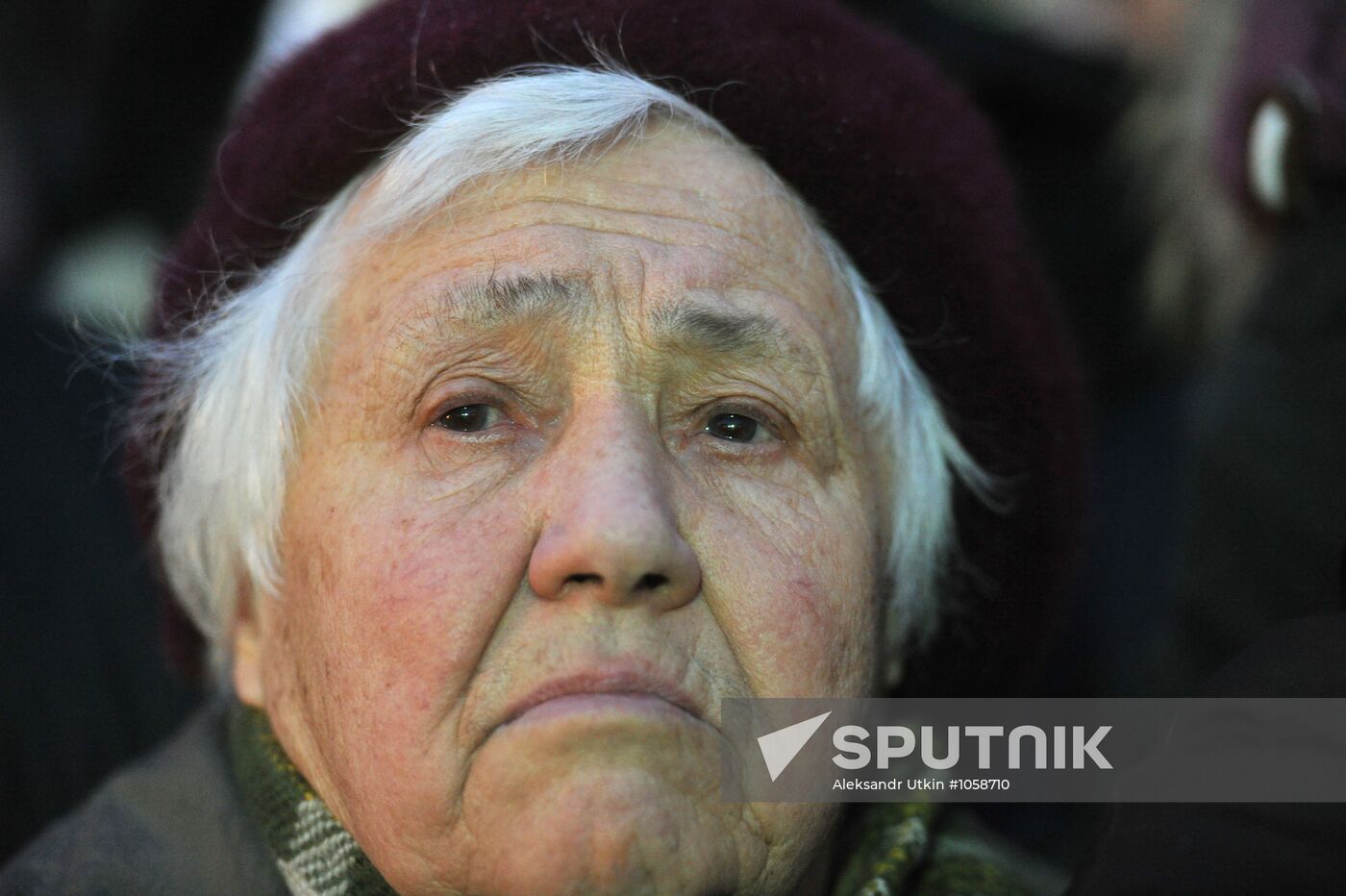 Faces of people rallying on Pushkin Square in Moscow