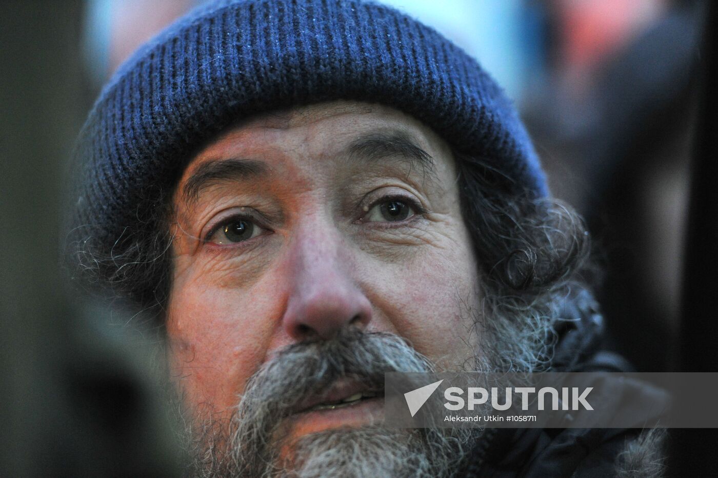 Faces of people rallying on Pushkin Square in Moscow