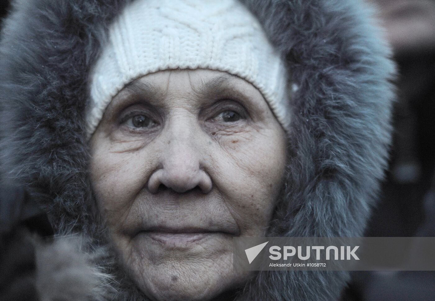 Faces of people rallying on Pushkin Square in Moscow