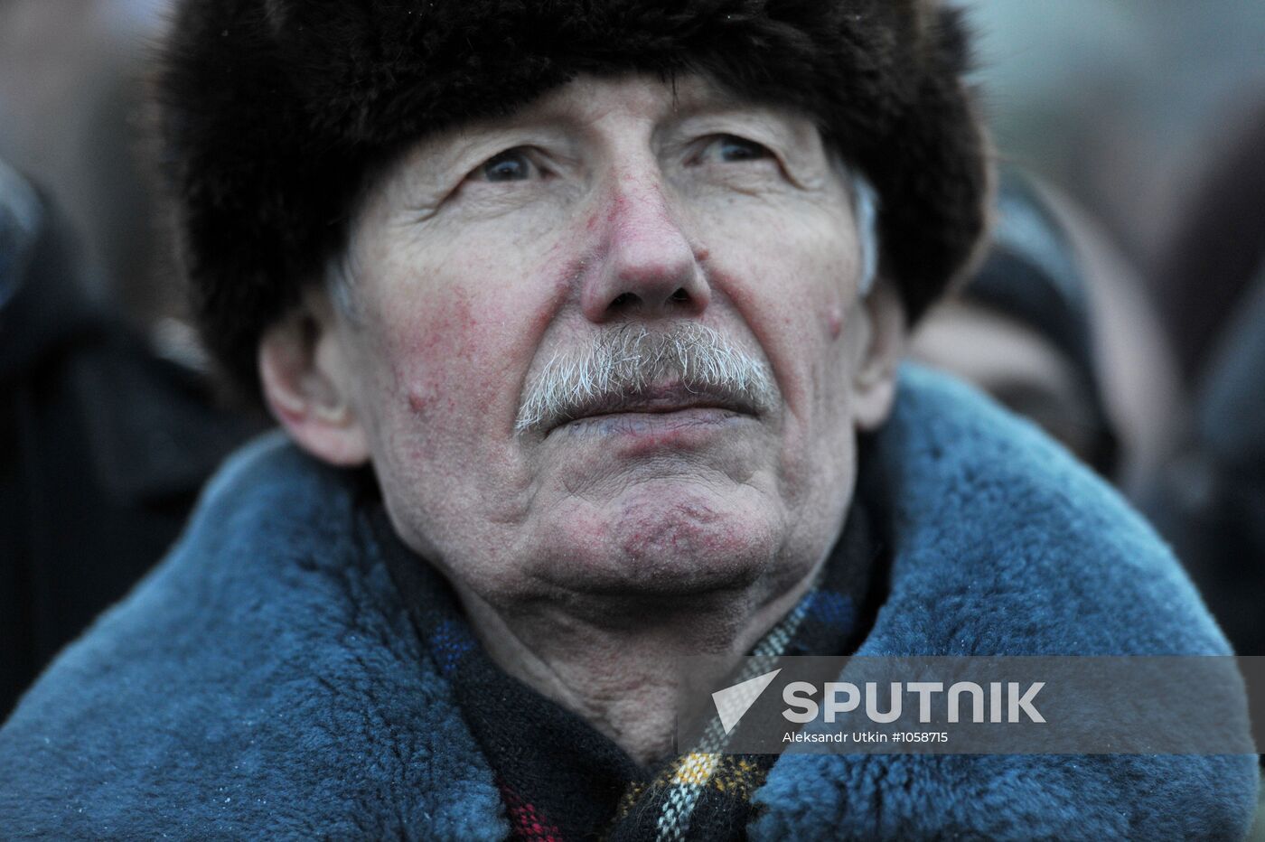 Faces of people rallying on Pushkin Square in Moscow