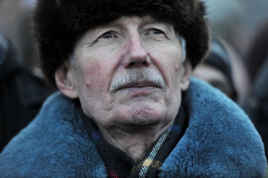 Faces of people rallying on Pushkin Square in Moscow