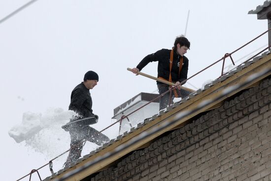 Clearing roofs of snow and ice