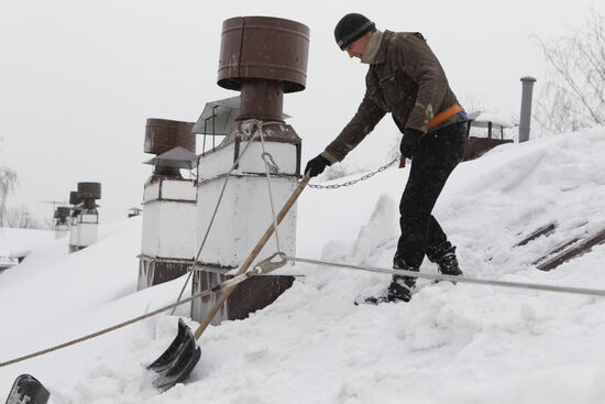 Clearing roofs of snow and ice