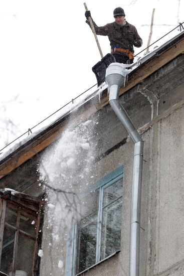 Clearing roofs of snow and ice