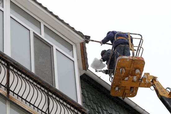 Clearing roofs of snow and ice