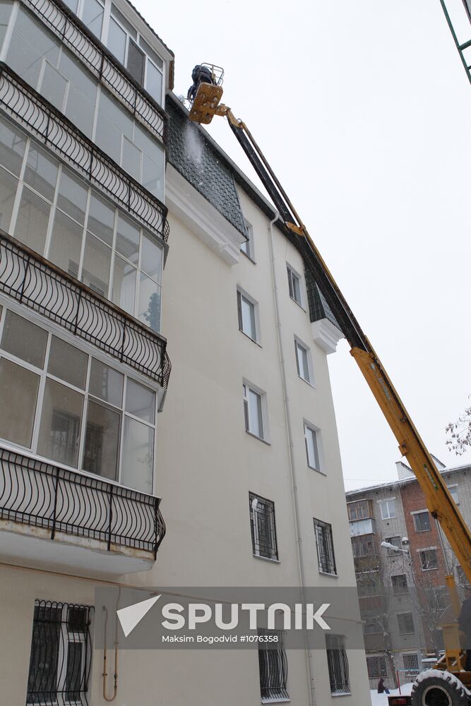 Clearing roofs of snow and ice