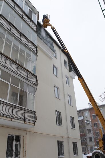 Clearing roofs of snow and ice