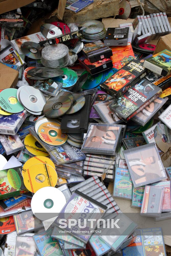 CD DVD COMPACT DISKS HEAP BULLDOZING