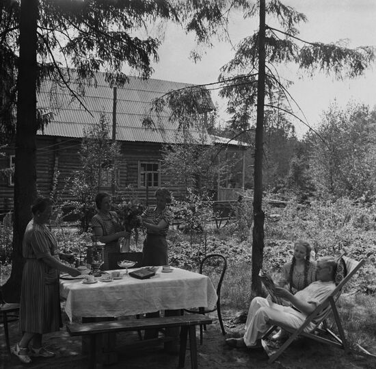 Fomichev family having tea in garden