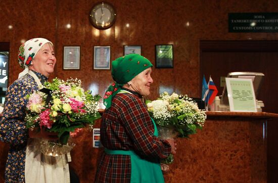 Members of Buranovskiye Babushki band arrive in Moscow