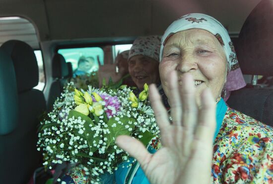 Members of Buranovskiye Babushki band arrive in Moscow