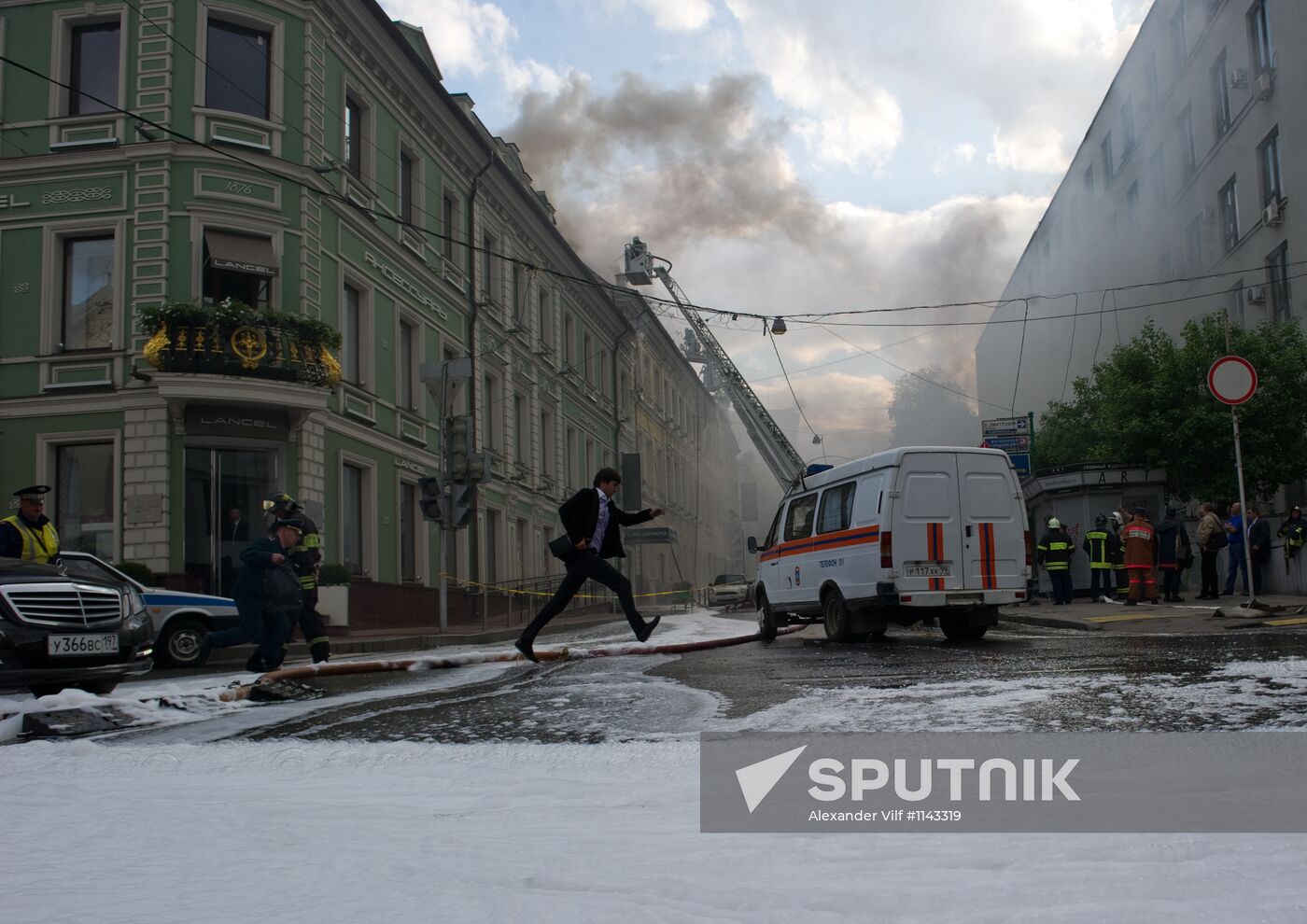 Old building on fire on Stoleshnikov Street in Moscow