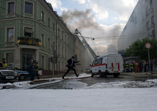 Old building on fire on Stoleshnikov Street in Moscow