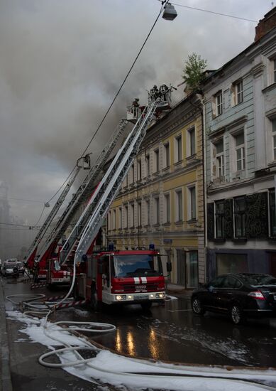 Old building on fire on Stoleshnikov Street in Moscow