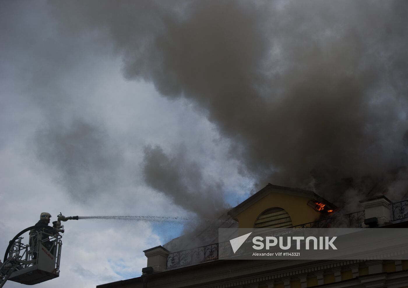 Old building on fire on Stoleshnikov Street in Moscow