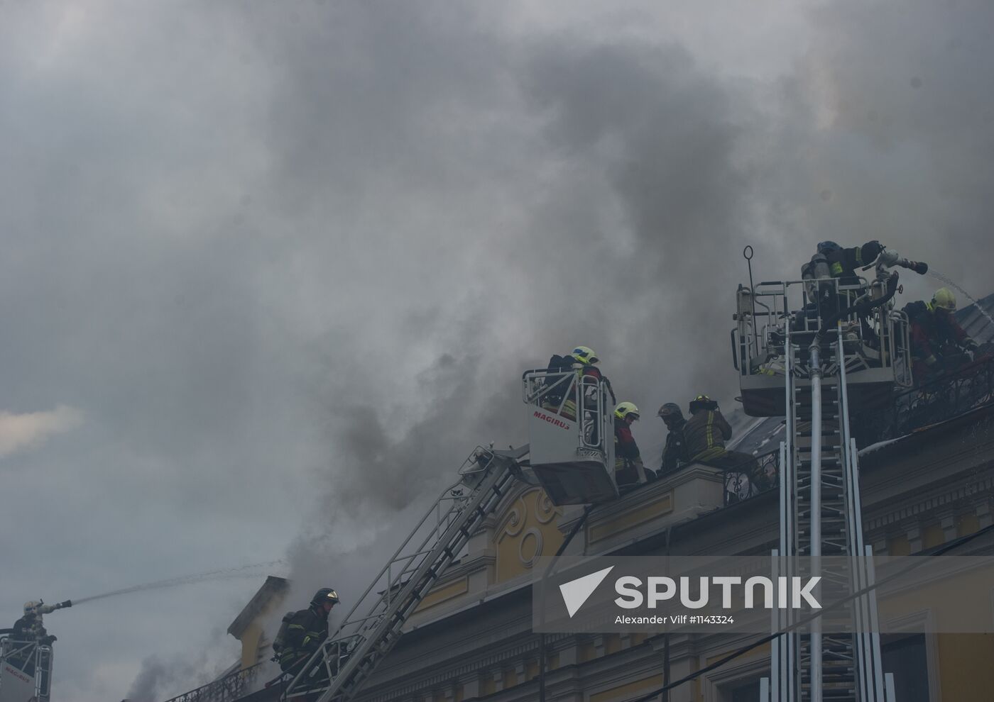 Old building on fire on Stoleshnikov Street in Moscow