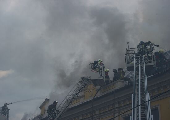 Old building on fire on Stoleshnikov Street in Moscow