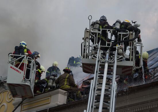 Old building on fire on Stoleshnikov Street in Moscow