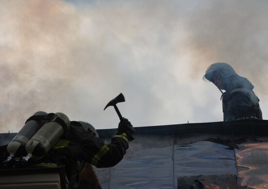 Old building on fire on Stoleshnikov Street in Moscow