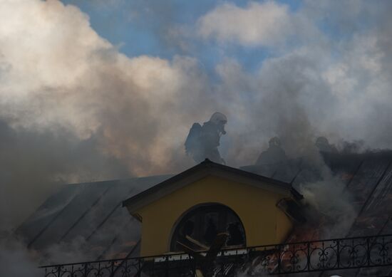 Old building on fire on Stoleshnikov Street in Moscow