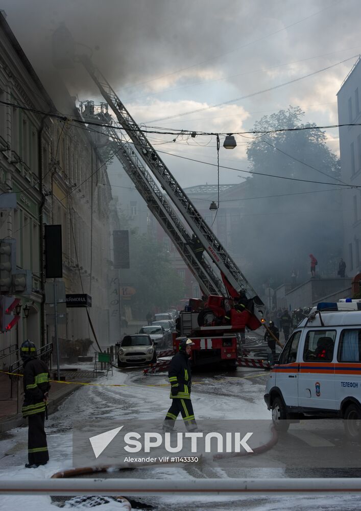 Old building on fire on Stoleshnikov Street in Moscow