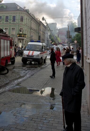 Old building in Stoleshnikov Street on fire