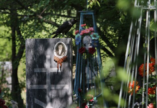 People visit cemeteries on Pentecost