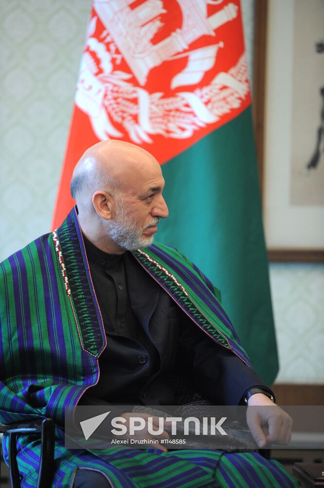 Vladimir Putin meets with Hamid Karzai