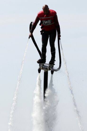 Flights over the lake on jet water board