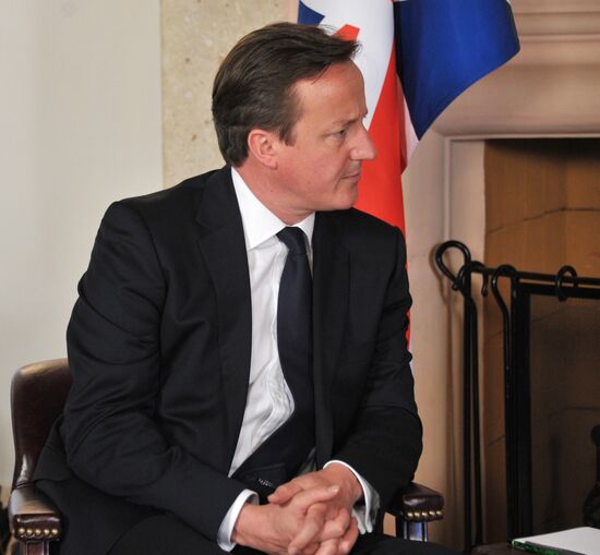 President Vladimir Putin meets with David Cameron in Mexico