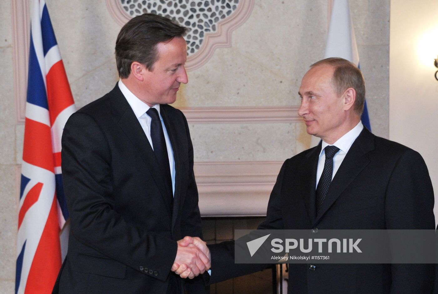 President Vladimir Putin meets with David Cameron in Mexico