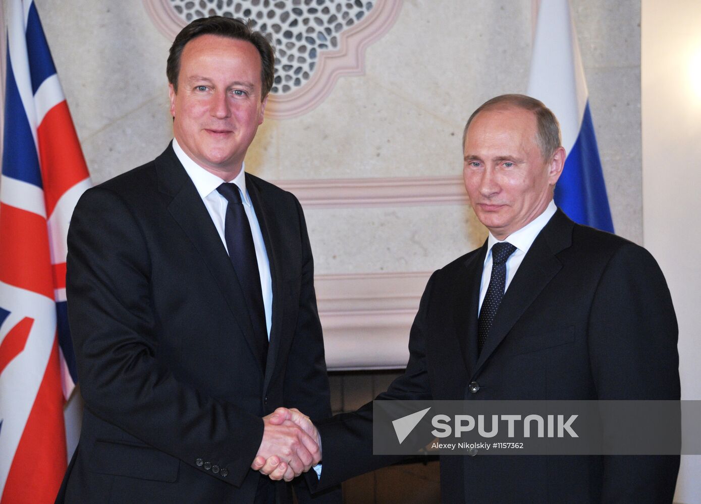 President Vladimir Putin meets with David Cameron in Mexico