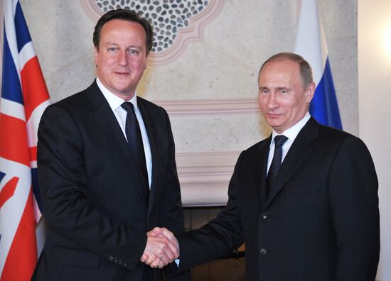 President Vladimir Putin meets with David Cameron in Mexico