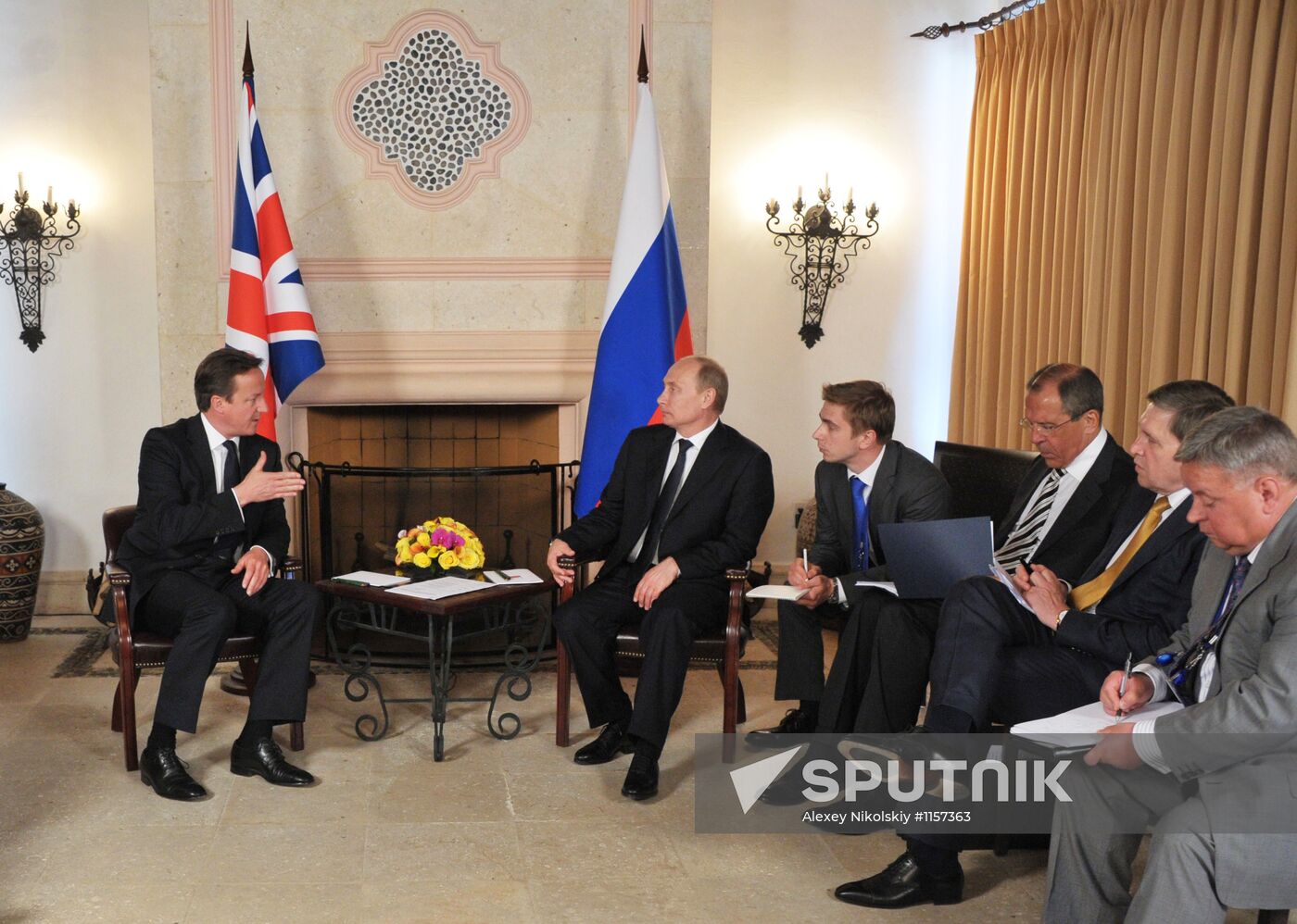 President Vladimir Putin meets with David Cameron in Mexico