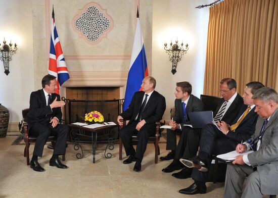 President Vladimir Putin meets with David Cameron in Mexico