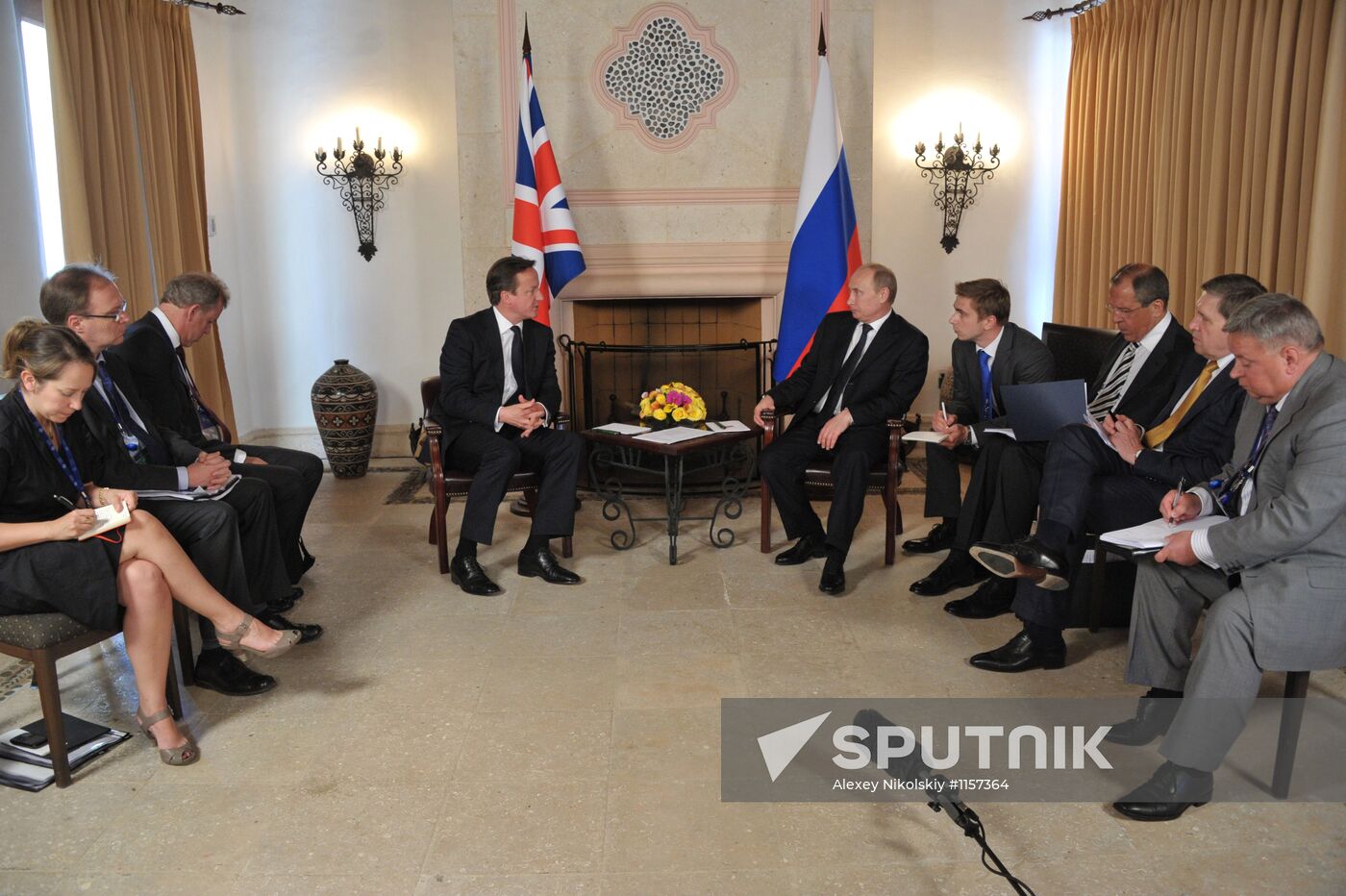 President Vladimir Putin meets with David Cameron in Mexico