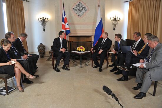 President Vladimir Putin meets with David Cameron in Mexico
