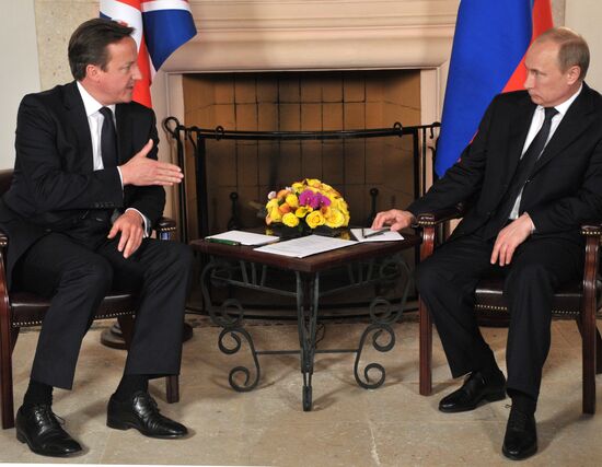 President Vladimir Putin meets with David Cameron in Mexico