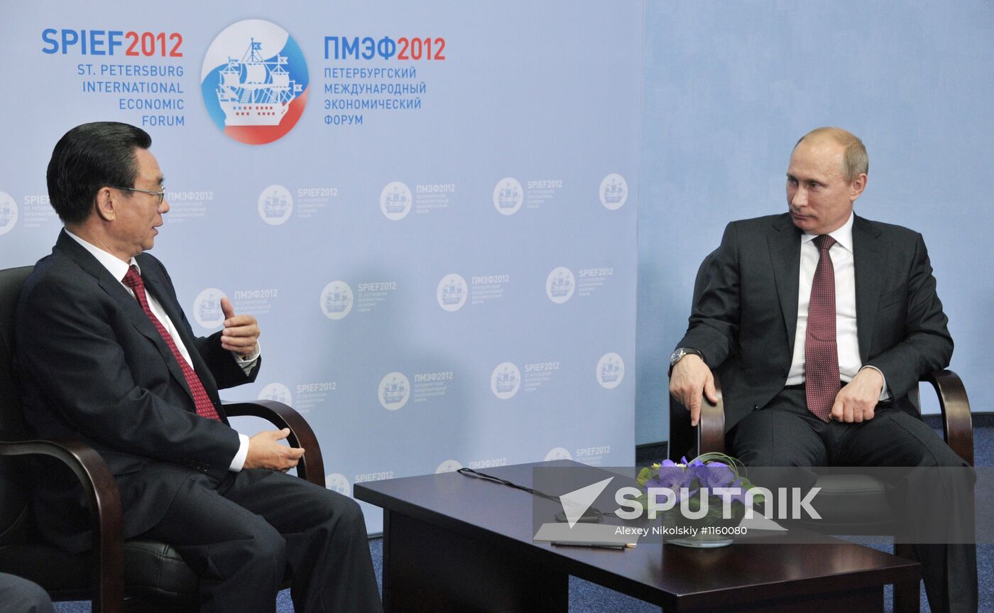 Vladimir Putin meets with He Guo-qiang in St.Petersburg