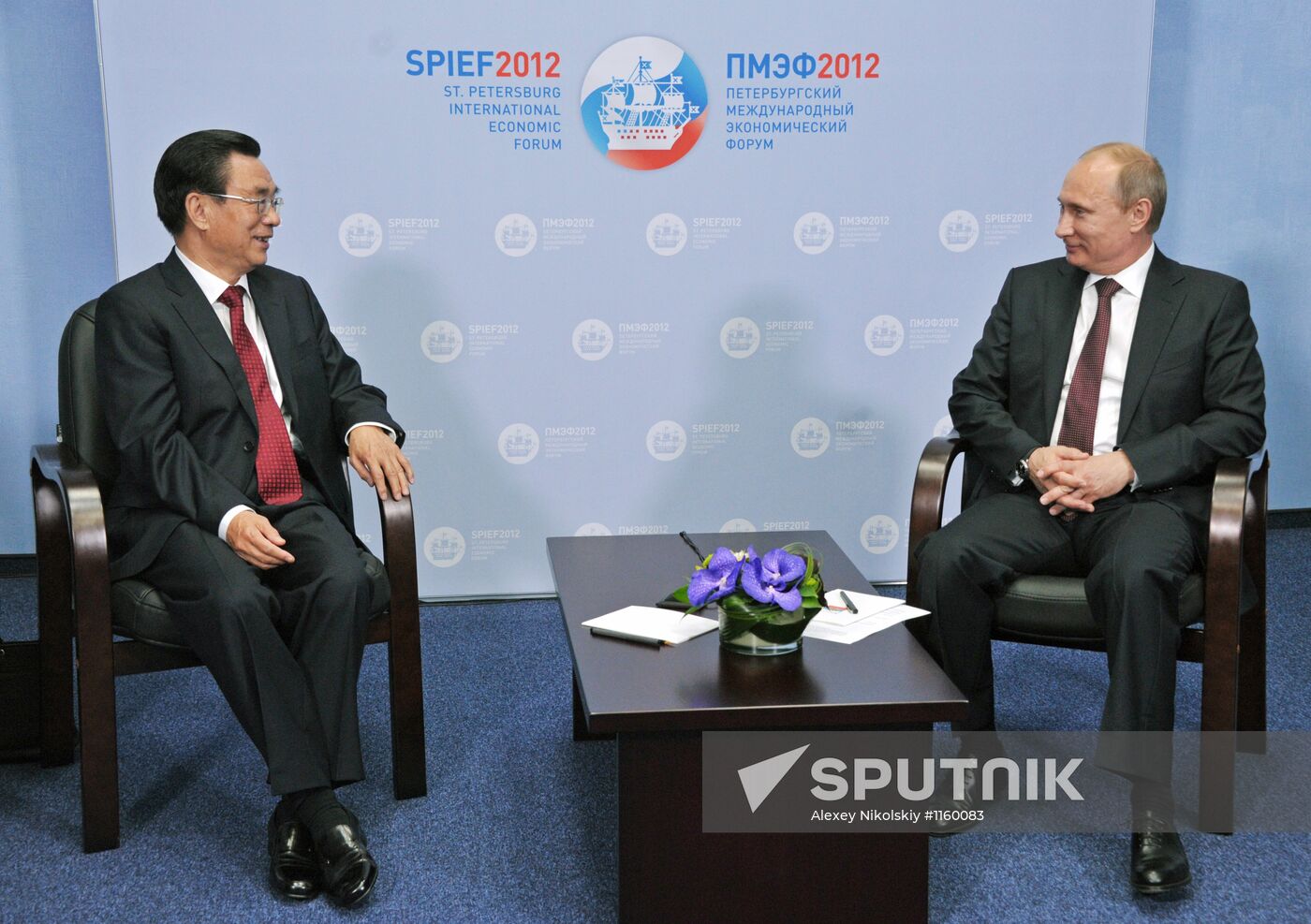 Vladimir Putin meets with He Guo-qiang in St.Petersburg