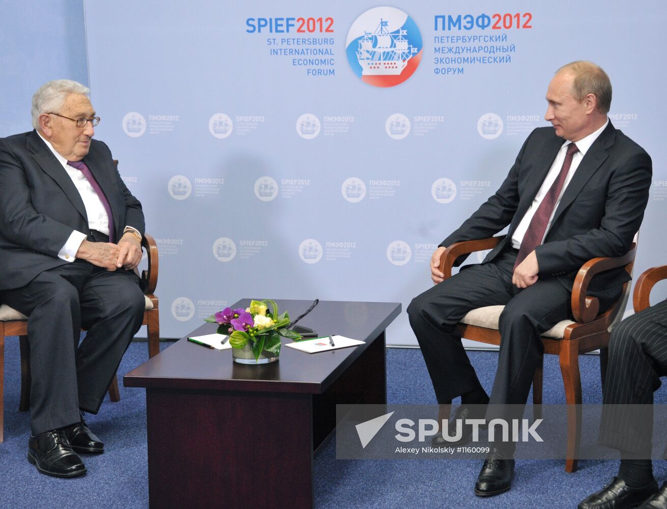 Vladimir Putin meets with Henry Kissinger in St Petersburg