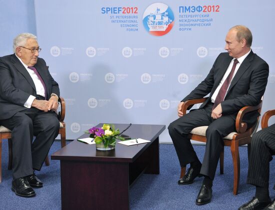 Vladimir Putin meets with Henry Kissinger in St Petersburg