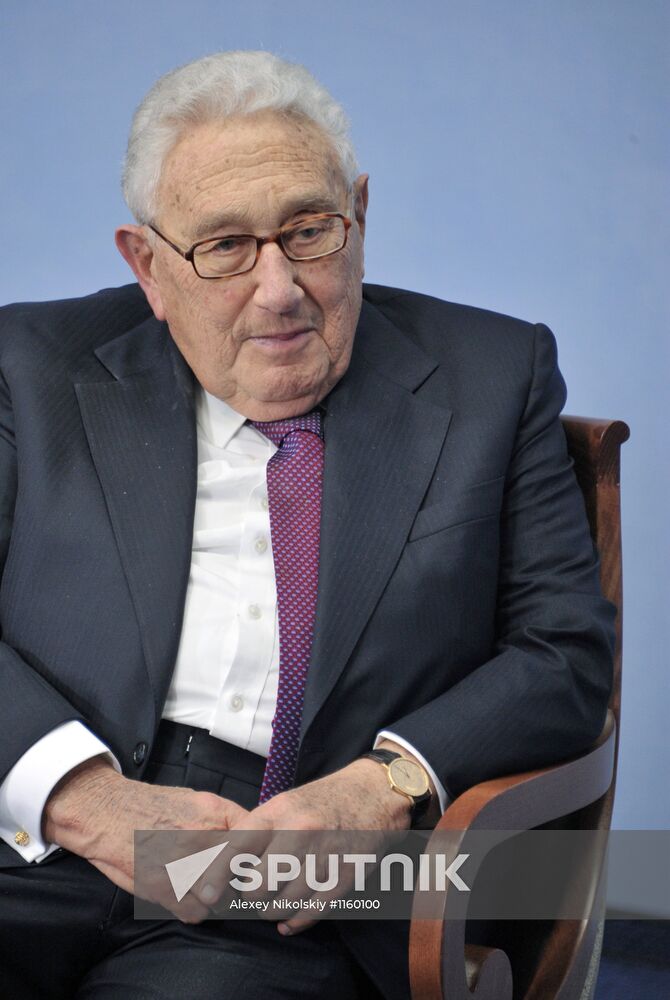 Vladimir Putin meets with Henry Kissinger in St Petersburg