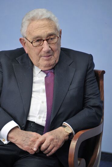 Vladimir Putin meets with Henry Kissinger in St Petersburg